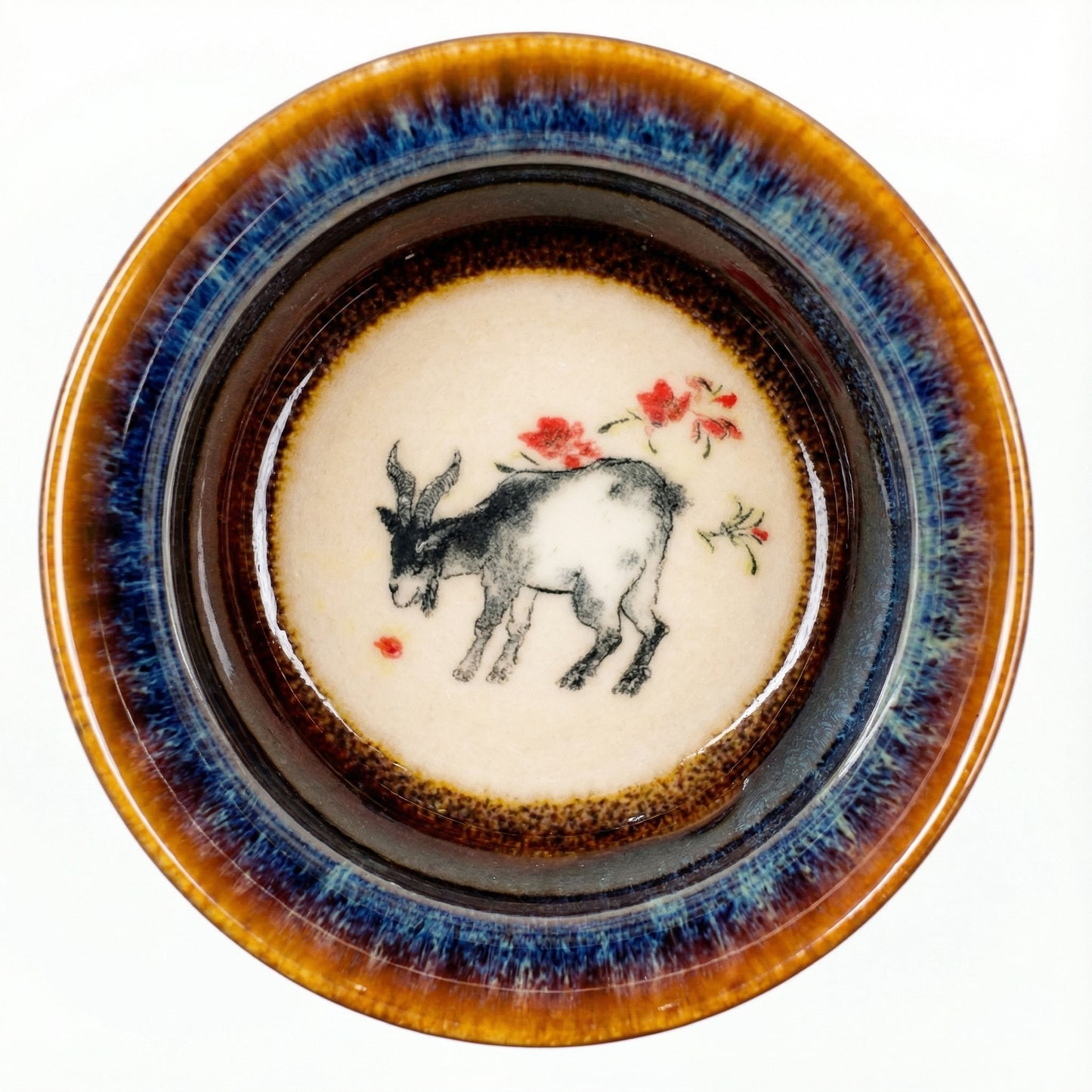 Elegant ceramic tea cup with a peaceful Goat motif, handcrafted with distinct glaze patterns.