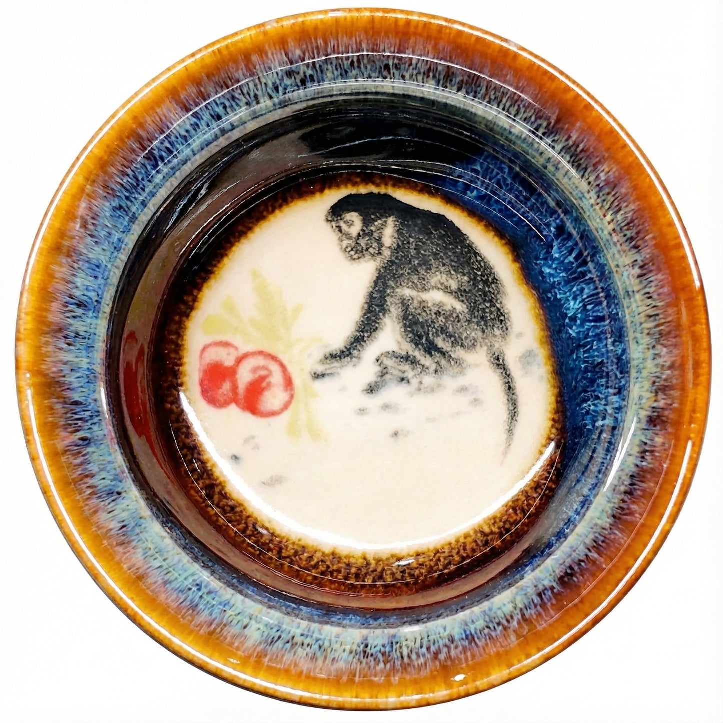 Playful Monkey design painted inside a ceramic tea bowl, a perfect addition to any tea set collection.